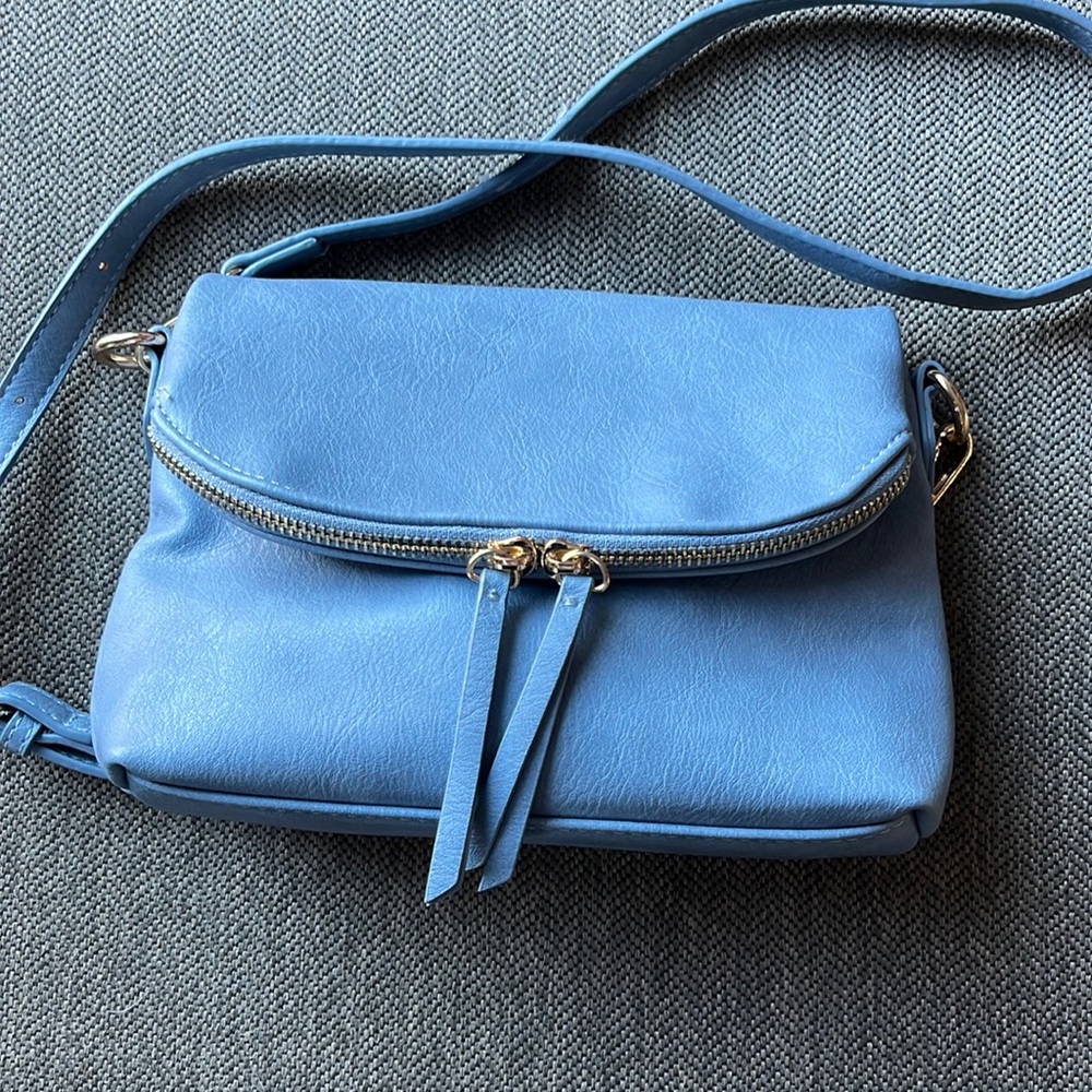 Light blue crossbody bag. Medium size. Only used one day.
